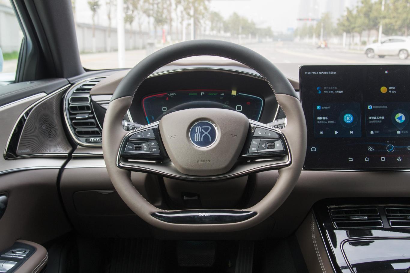 Red-accented steering wheel inside a BYD Han EV luxury electric car, a symbol of the red pfp aesthetic