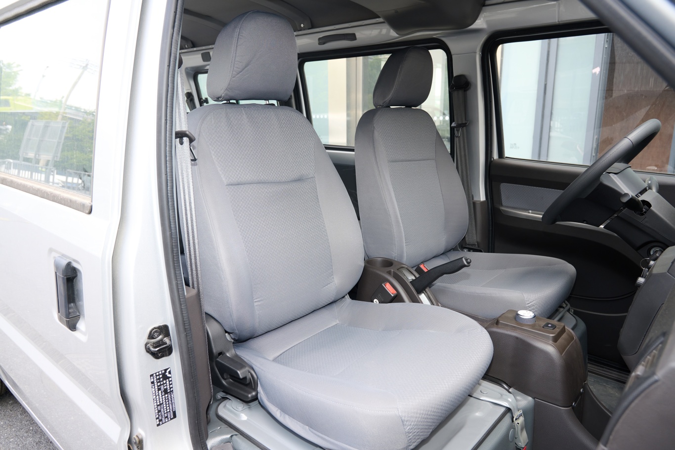 Heavy duty truck passenger seat